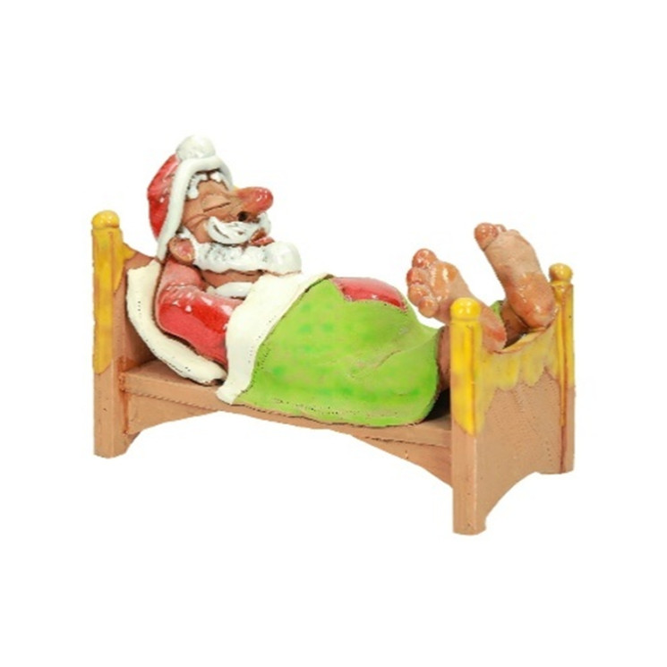 Müder Weihnachtsmann im Bett | Keramik-Räucherfigur | momolio.de